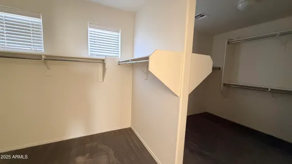 a view of walk in closet with window