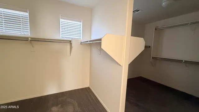 a view of walk in closet with window