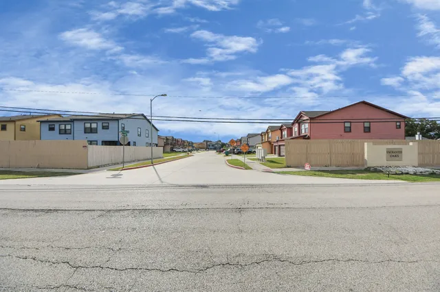 an aerial view of residential house with outdoor space and parking