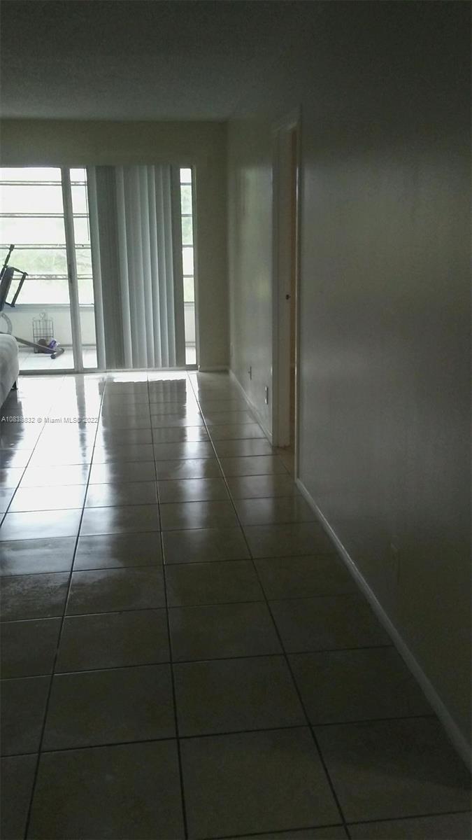 8411 Lagos De Campo Boulevard, Unit 303U Tamarac, FL 33321 - Photo 2 of 7 a view of a hallway