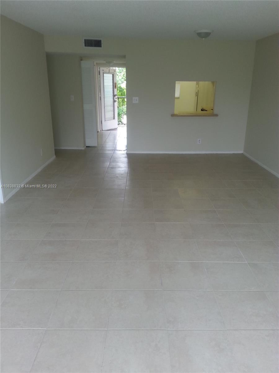 8411 Lagos De Campo Boulevard, Unit 303U Tamarac, FL 33321 - Photo 3 of 7 a view of an empty room with a window