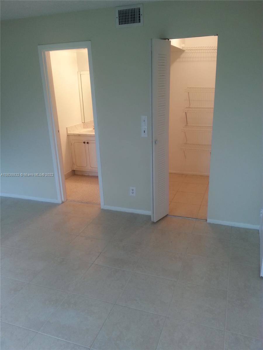 8411 Lagos De Campo Boulevard, Unit 303U Tamarac, FL 33321 - Photo 6 of 7 an empty room with windows