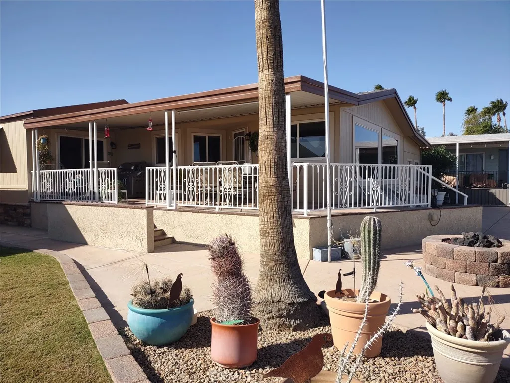 554 Beach Needles Ca Needles, CA 92363 - Photo 1 of 31 a view of a patio with couches chairs and potted plants