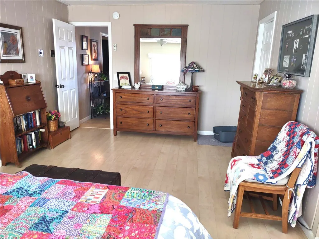 554 Beach Needles Ca Needles, CA 92363 - Photo 11 of 31 a bed room with a bed and a chair