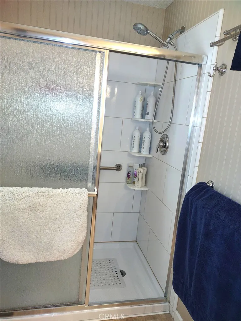 554 Beach Needles Ca Needles, CA 92363 - Photo 13 of 31 a bathroom with a glass shower door
