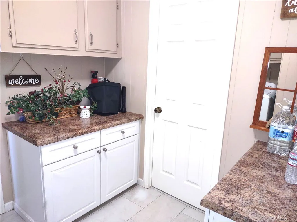 554 Beach Needles Ca Needles, CA 92363 - Photo 19 of 31 a kitchen with stainless steel appliances granite countertop a sink and cabinets