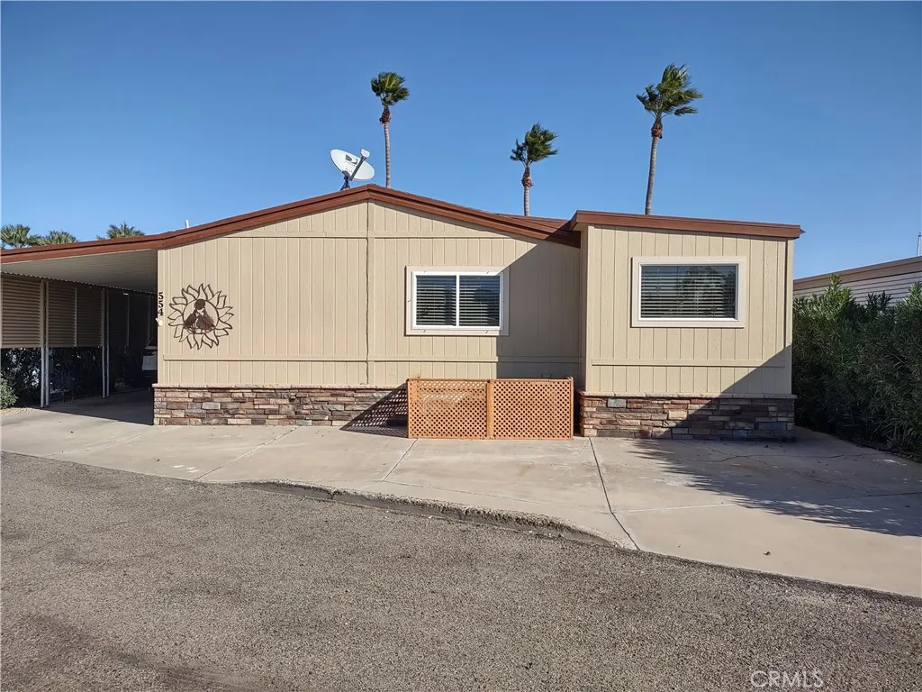 554 Beach Needles Ca Needles, CA 92363 - Photo 27 of 31 a front view of a house with a yard