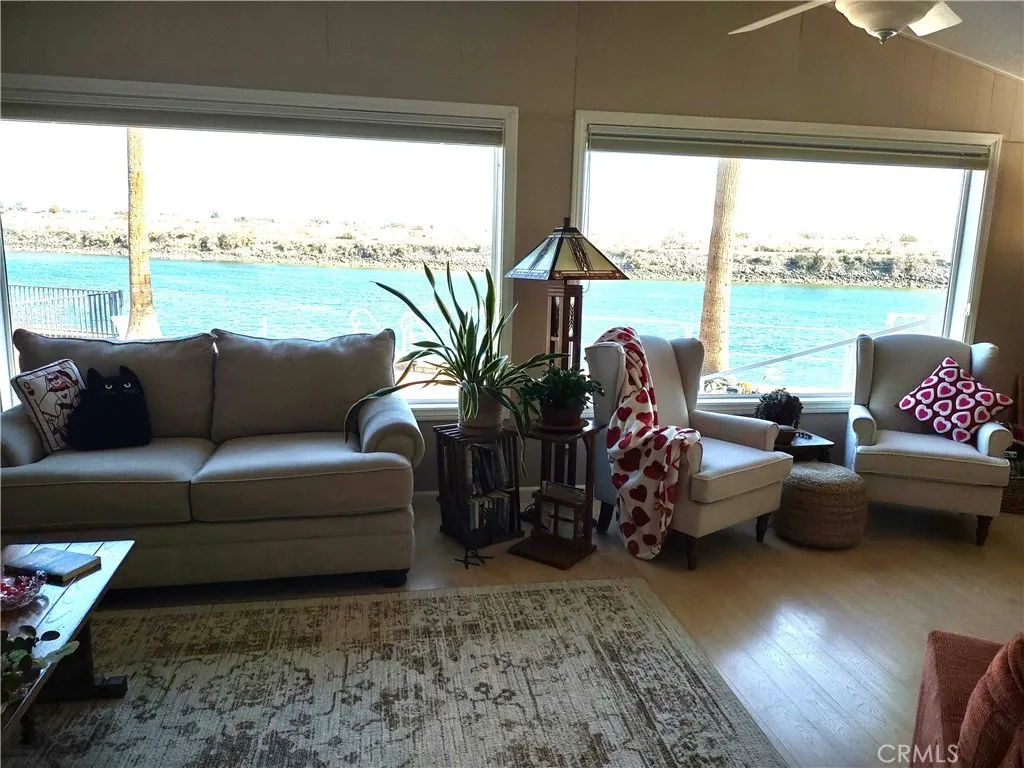554 Beach Needles Ca Needles, CA 92363 - Photo 6 of 31 a living room with furniture and floor to ceiling windows
