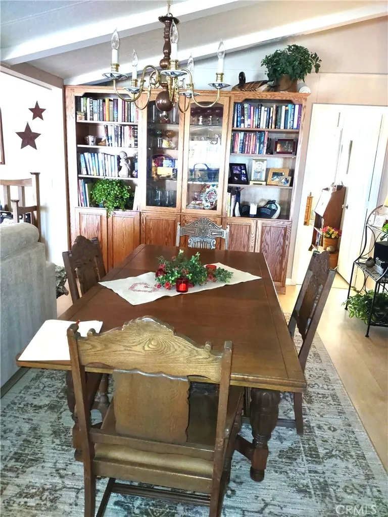 554 Beach Needles Ca Needles, CA 92363 - Photo 9 of 31 a view of a dining room with furniture and chandelier