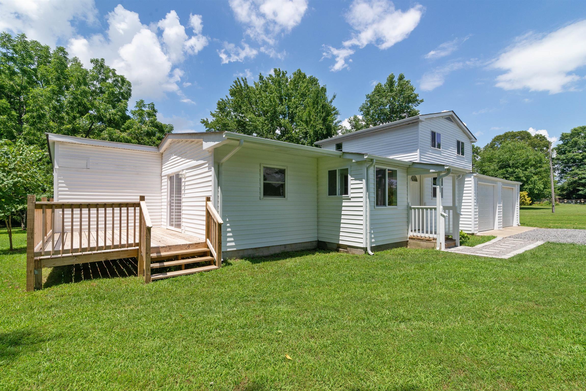 456 Boiling Springs Road Portland, TN 37148 - Photo 1 of 28 a front view of a house with a garden