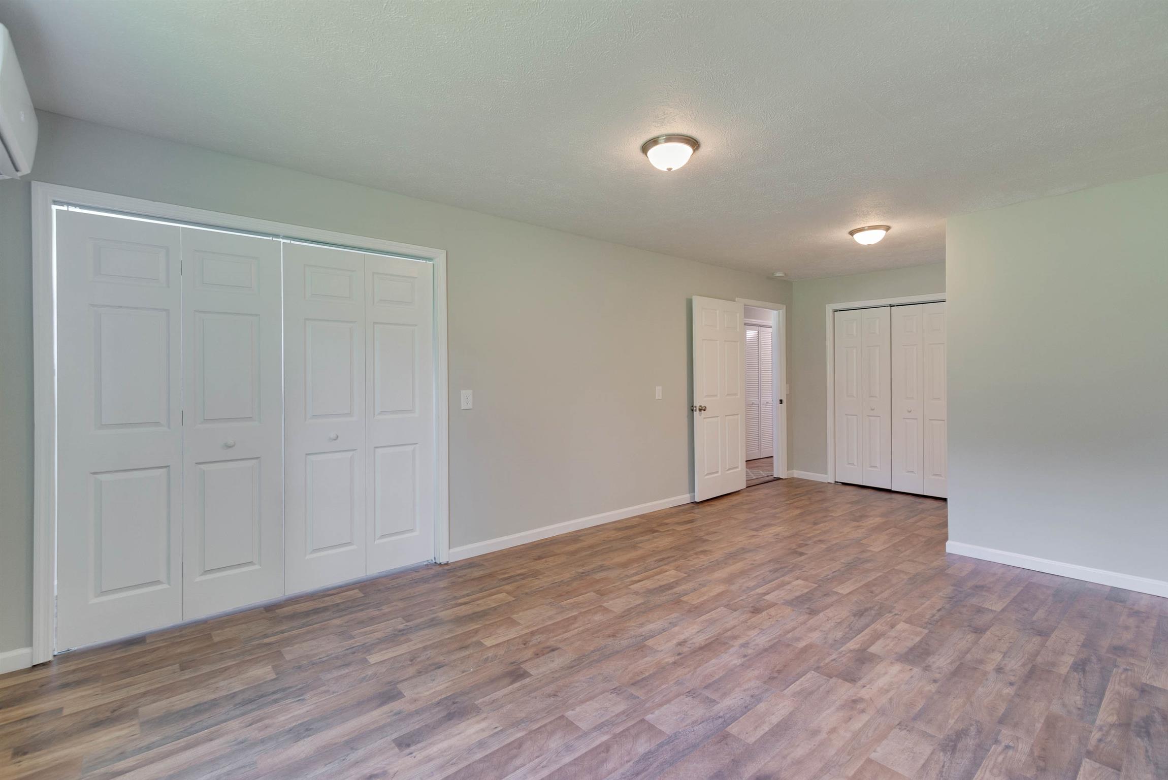 456 Boiling Springs Road Portland, TN 37148 - Photo 15 of 28 a view of an empty room with wooden floor