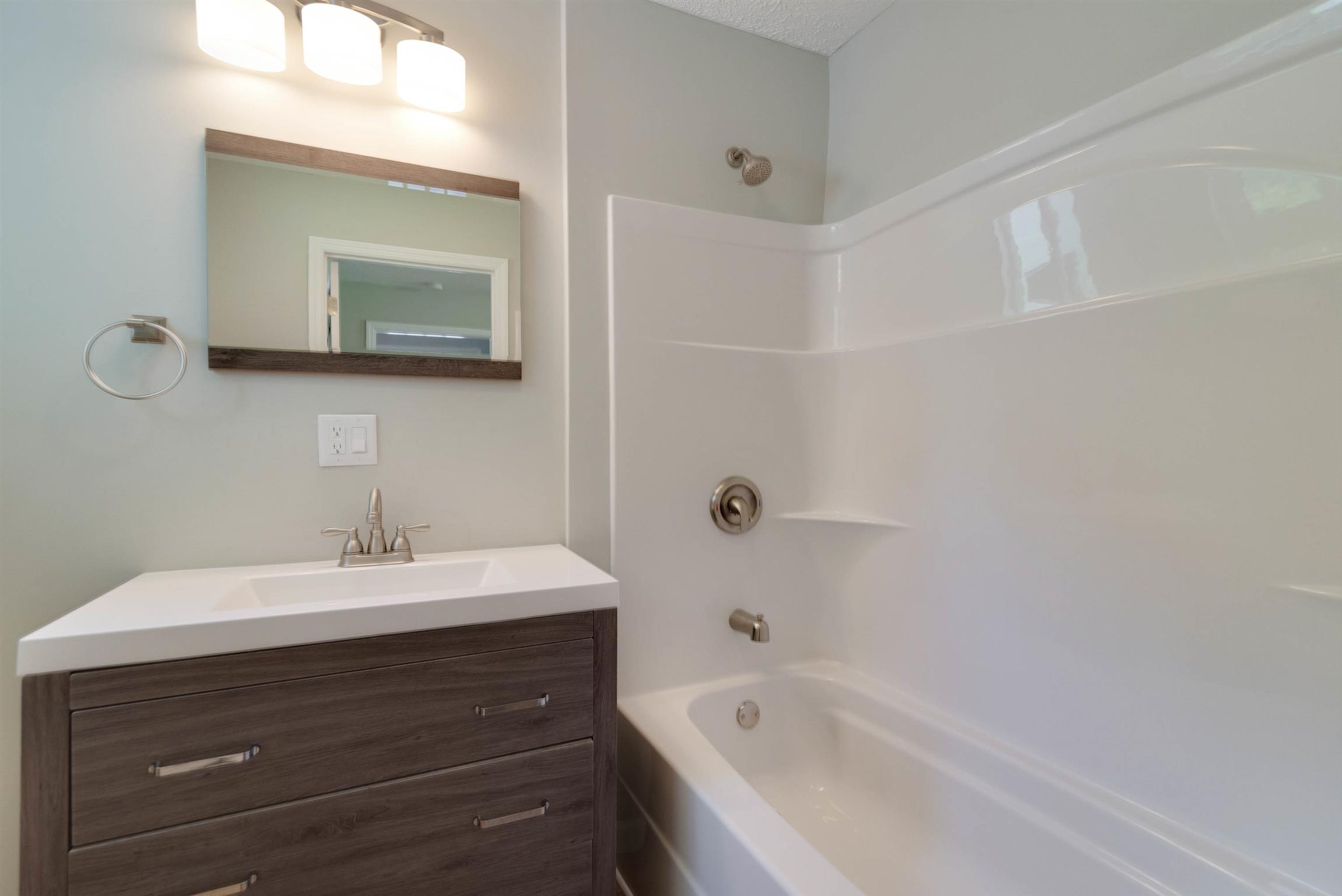 456 Boiling Springs Road Portland, TN 37148 - Photo 16 of 28 a bathroom with a bathtub sink and mirror