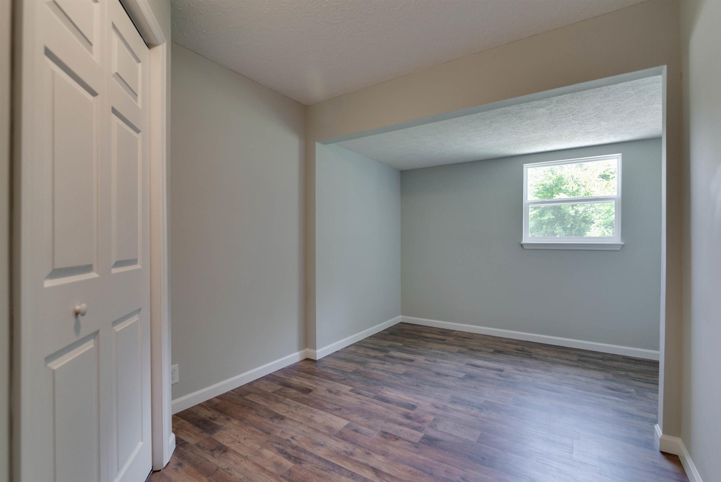 456 Boiling Springs Road Portland, TN 37148 - Photo 17 of 28 a view of room with hardwood floor and hallway