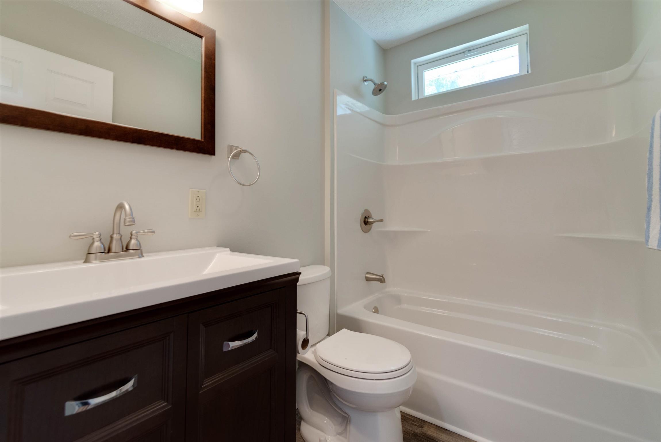 456 Boiling Springs Road Portland, TN 37148 - Photo 19 of 28 a bathroom with a sink a toilet and shower