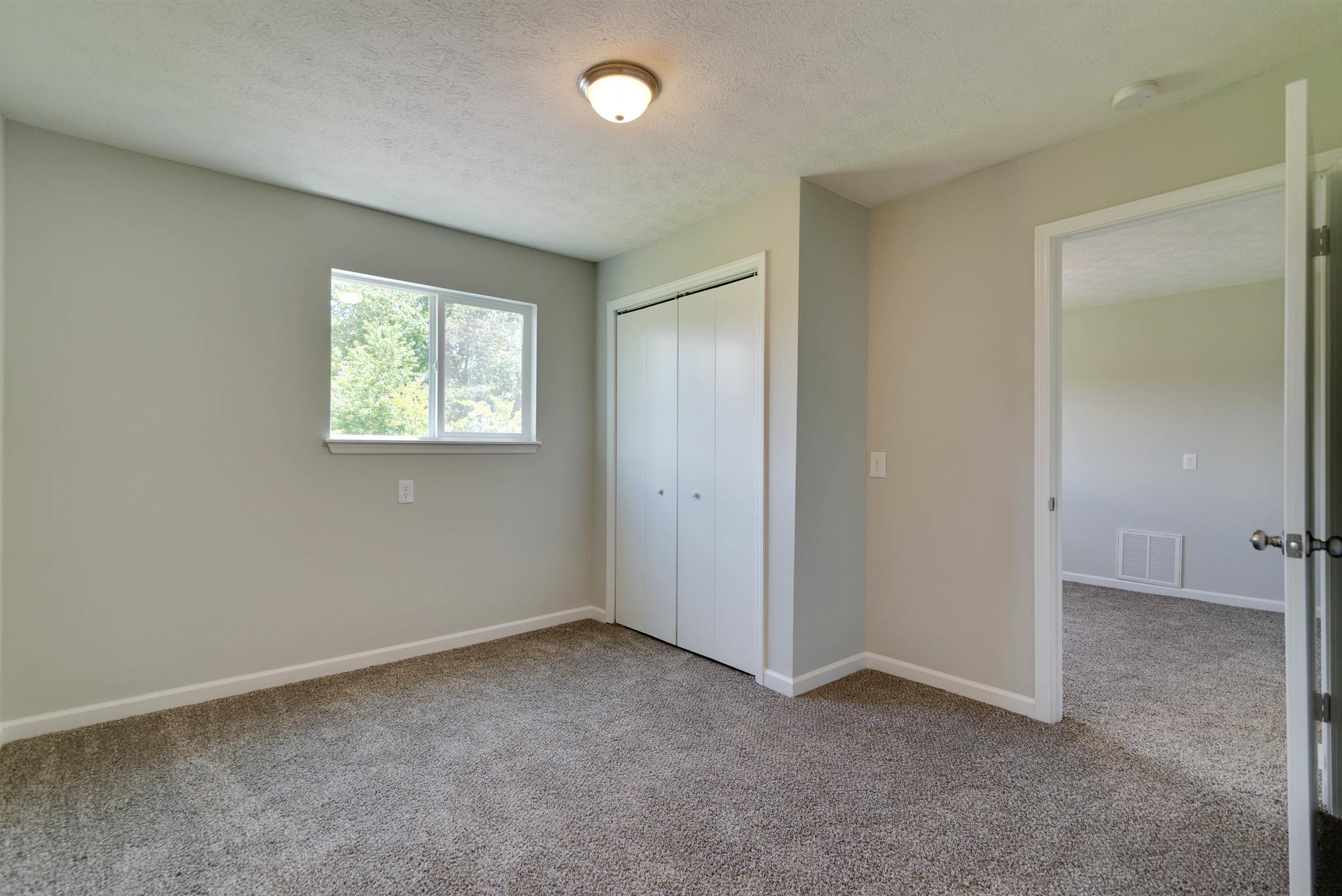 456 Boiling Springs Road Portland, TN 37148 - Photo 20 of 28 an empty room with windows and closet