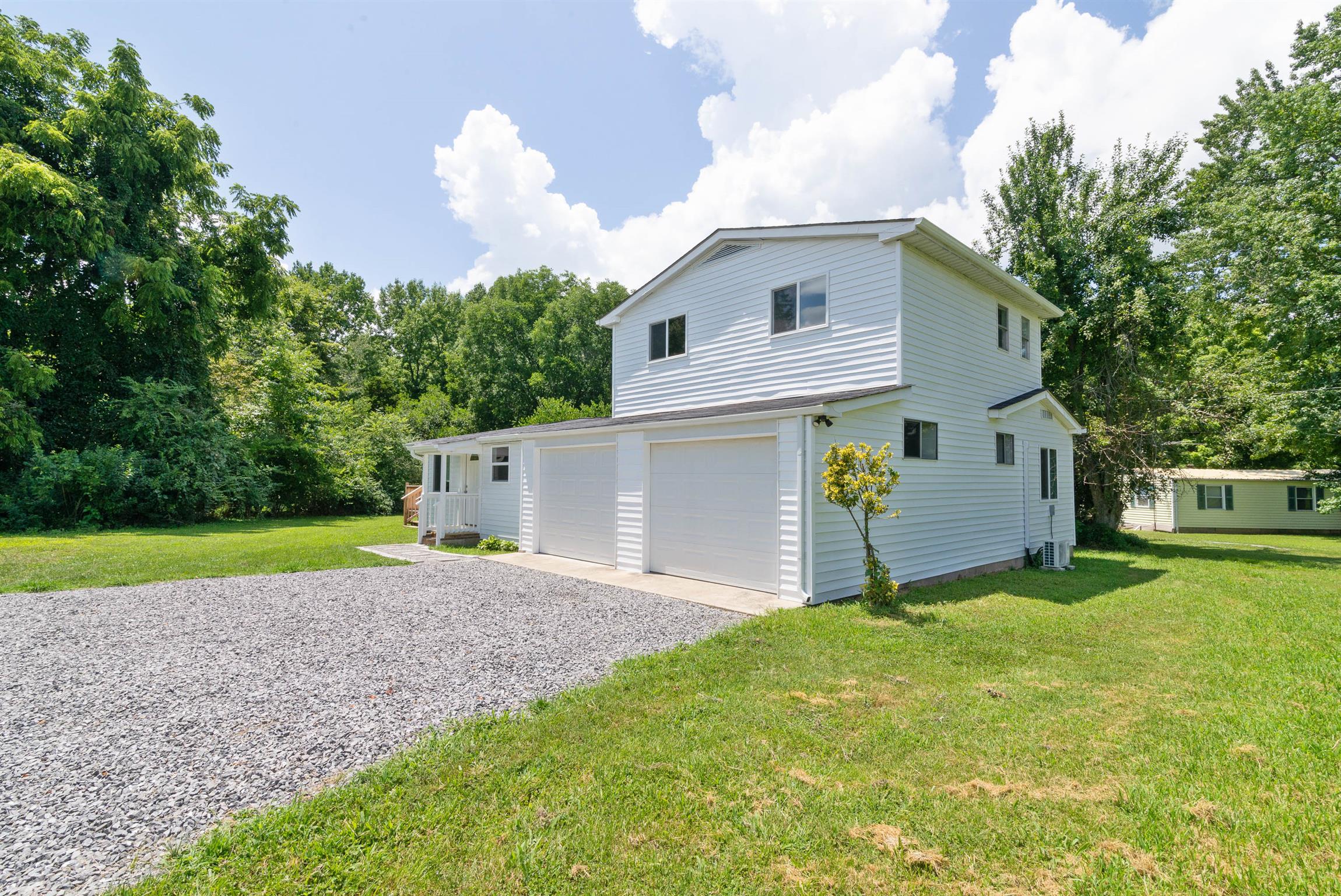 456 Boiling Springs Road Portland, TN 37148 - Photo 2 of 28 a view of a house with a yard and a large tree