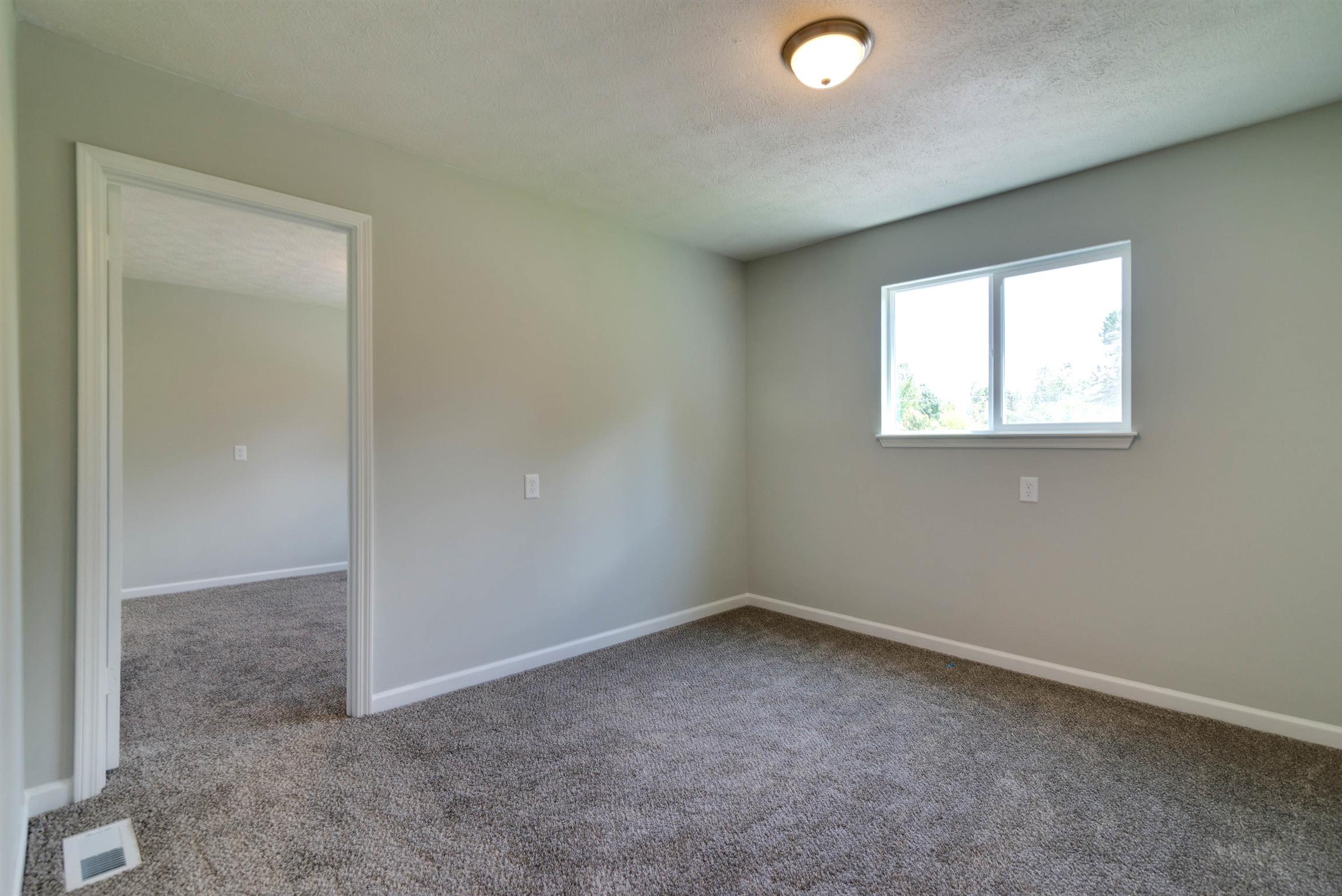 456 Boiling Springs Road Portland, TN 37148 - Photo 22 of 28 an empty room with a empty space and windows