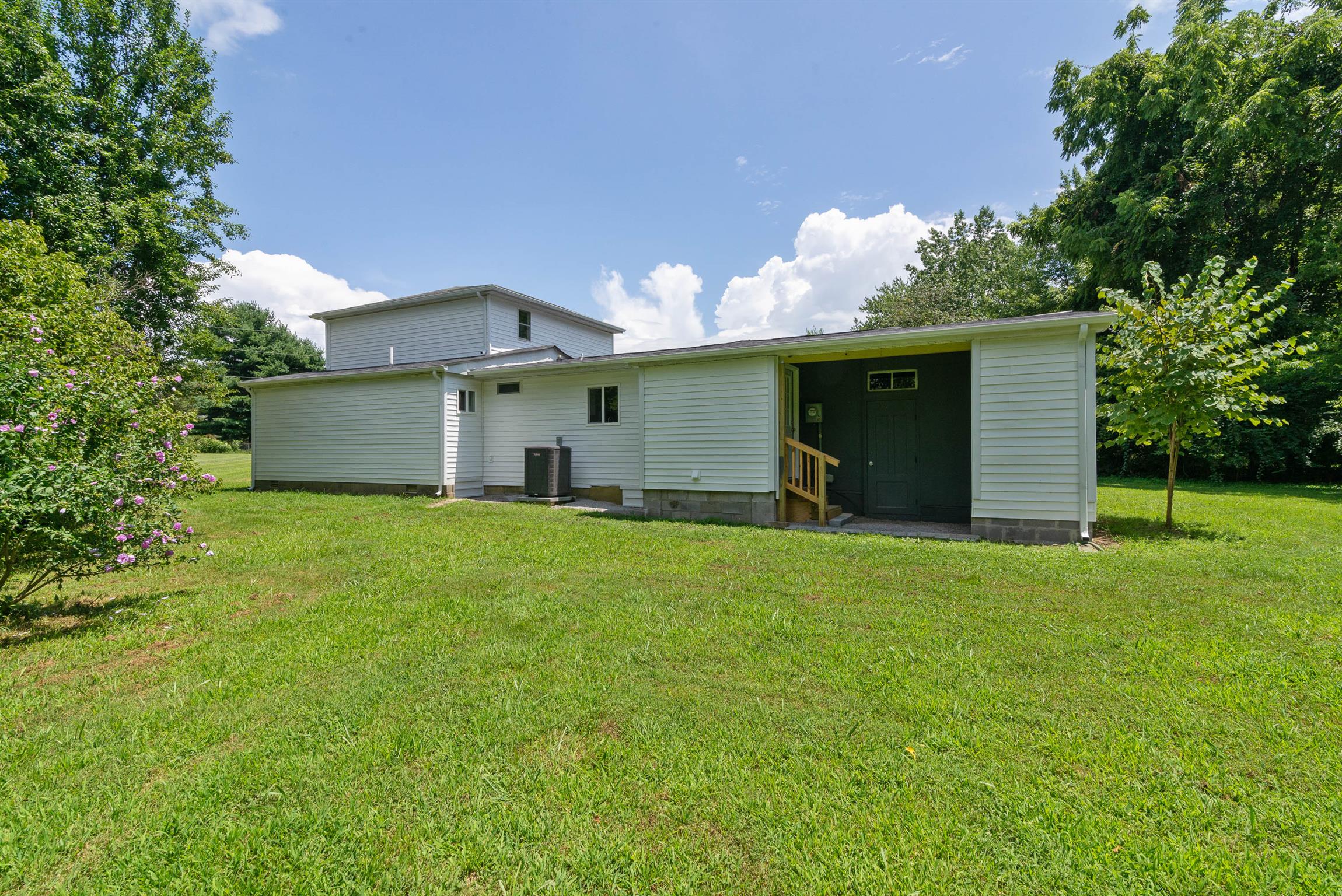 456 Boiling Springs Road Portland, TN 37148 - Photo 26 of 28 a front view of house with yard and trees in the background