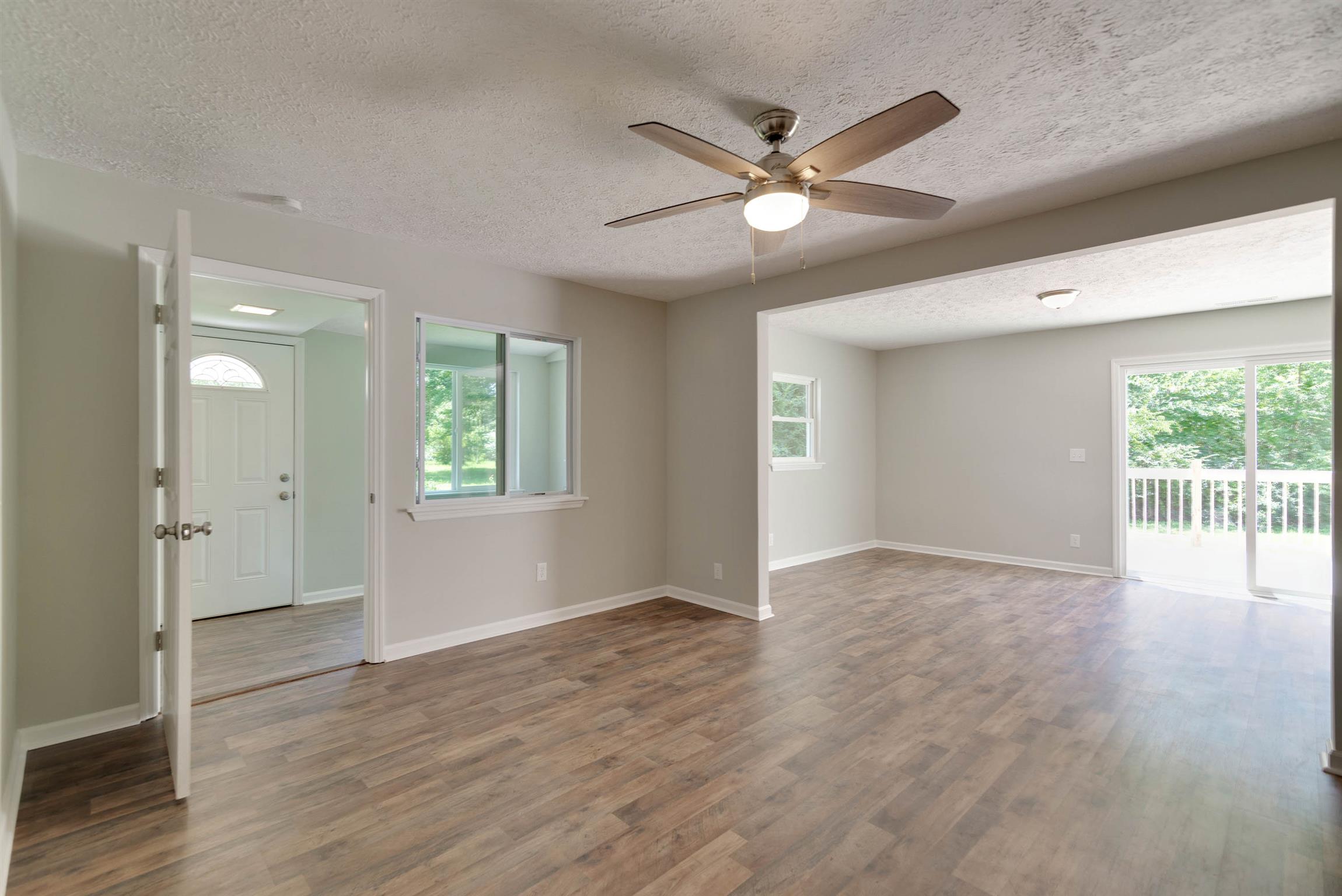 456 Boiling Springs Road Portland, TN 37148 - Photo 8 of 28 a view of an empty room with wooden floor and a window