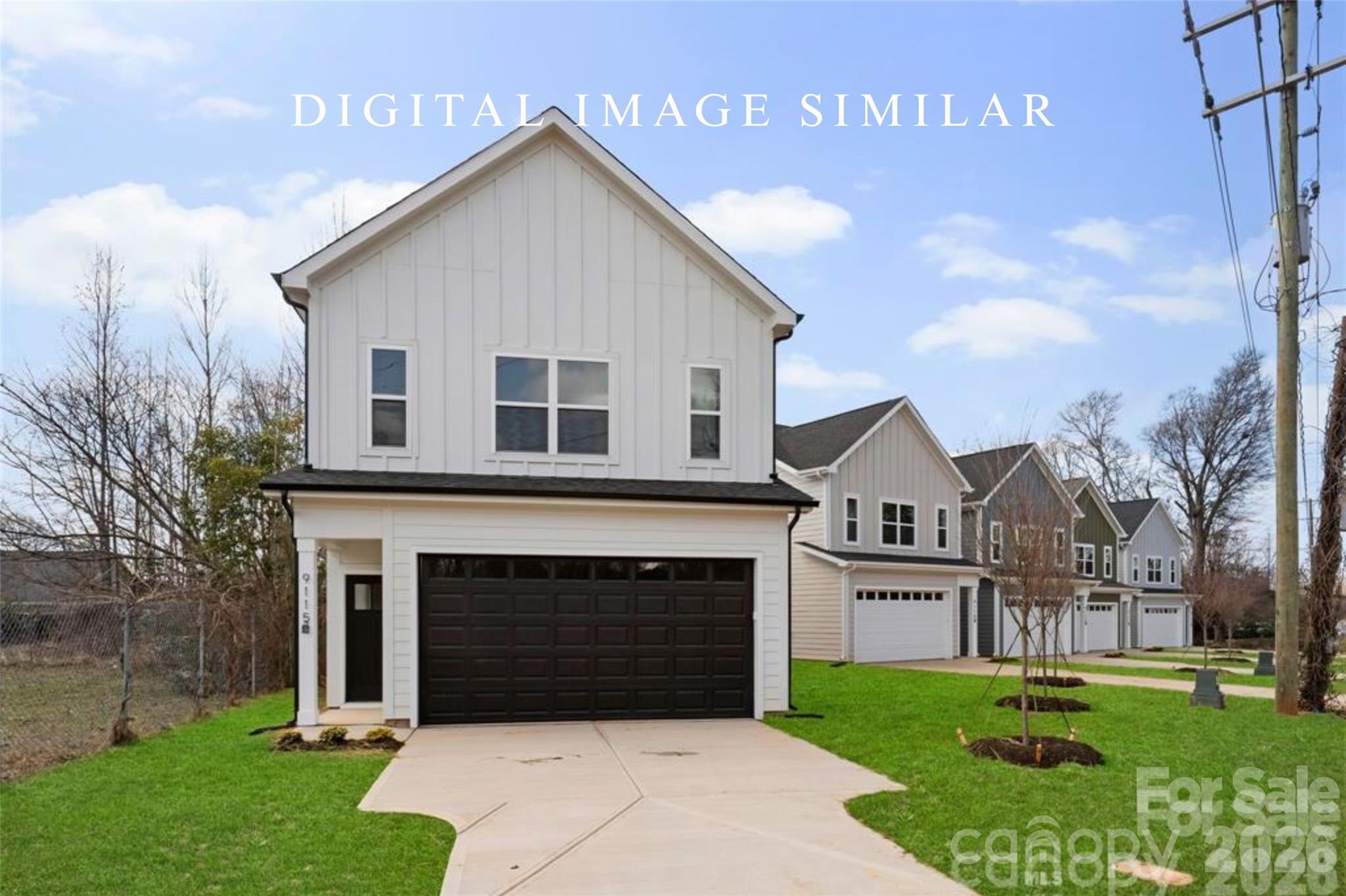 2928 Mulberry Church Road Charlotte, NC 28208 - Photo 28 of 43 a front view of a house with a yard and garage