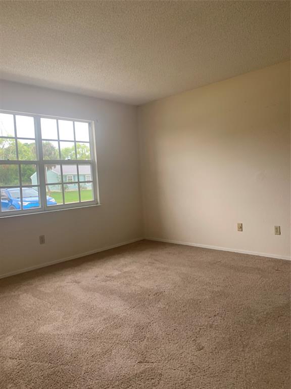 2273 Southeast Merrill Road Port St. Lucie, FL 34952 - Photo 3 of 8 an empty room with a window