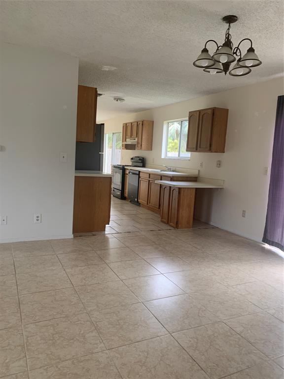 2273 Southeast Merrill Road Port St. Lucie, FL 34952 - Photo 4 of 8 a view of living room with furniture and window