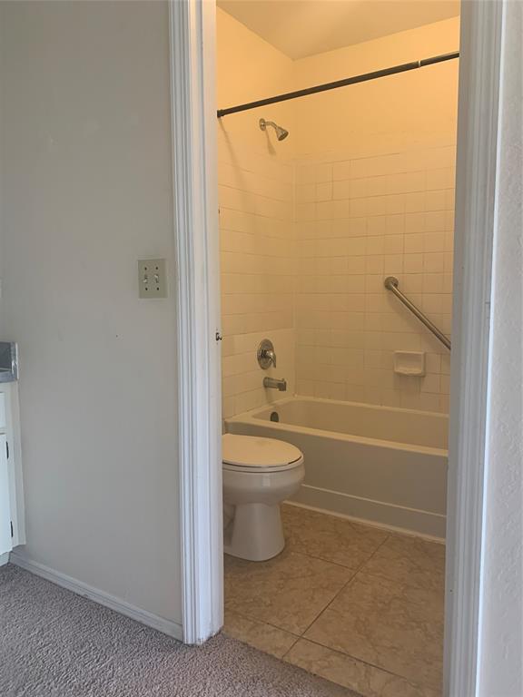 2273 Southeast Merrill Road Port St. Lucie, FL 34952 - Photo 6 of 8 a bathroom with a toilet and a shower