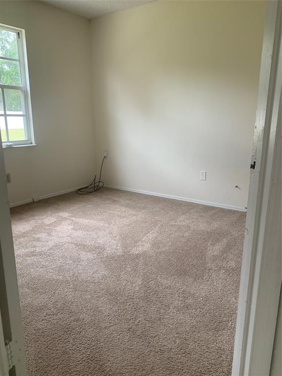 2273 Southeast Merrill Road Port St. Lucie, FL 34952 - Photo 8 of 8 an empty room with a window