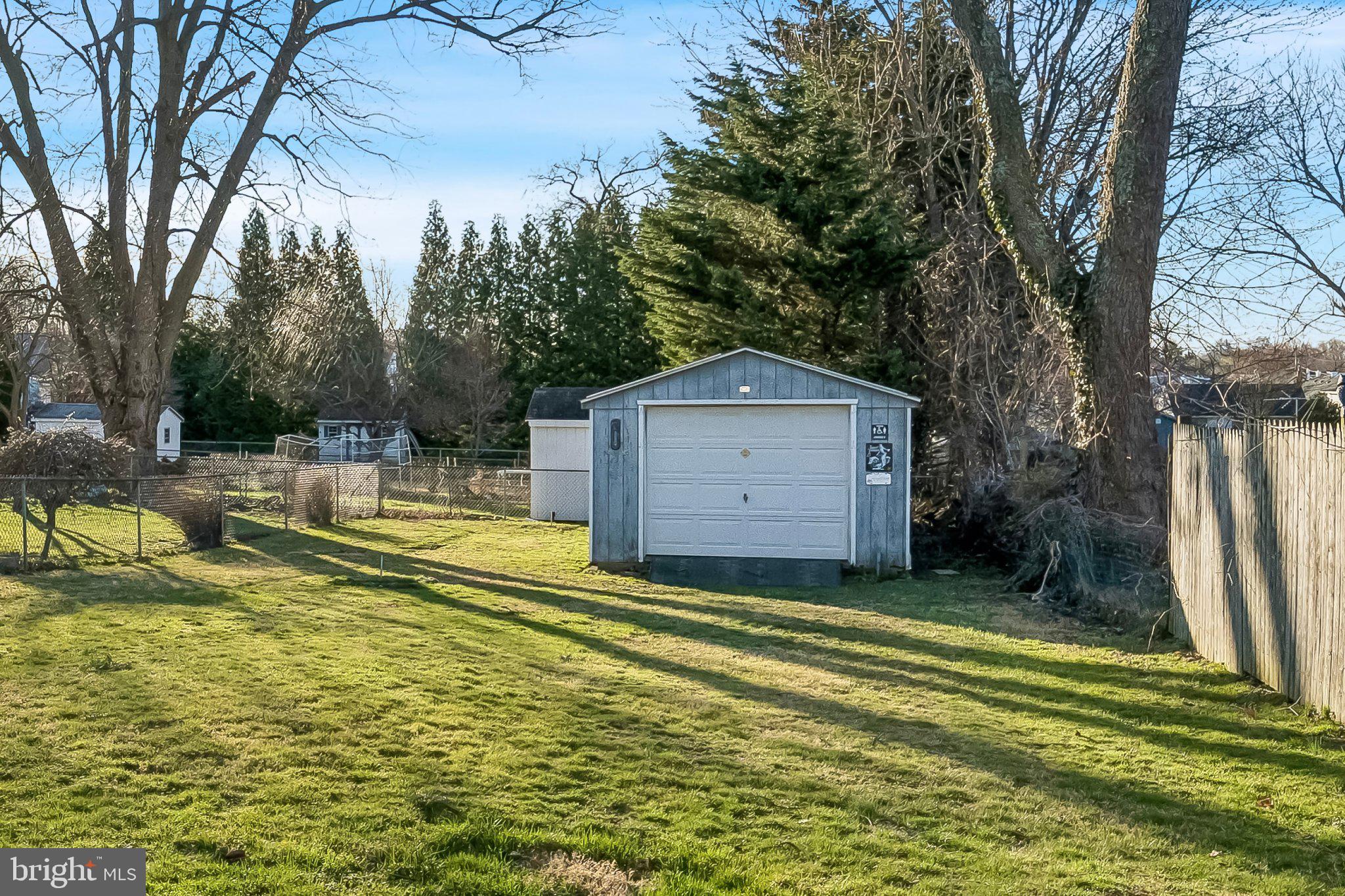 309 Dutton Mill Road Brookhaven, PA 19015 - Photo 18 of 24 Charming backyard with a storage shed.
