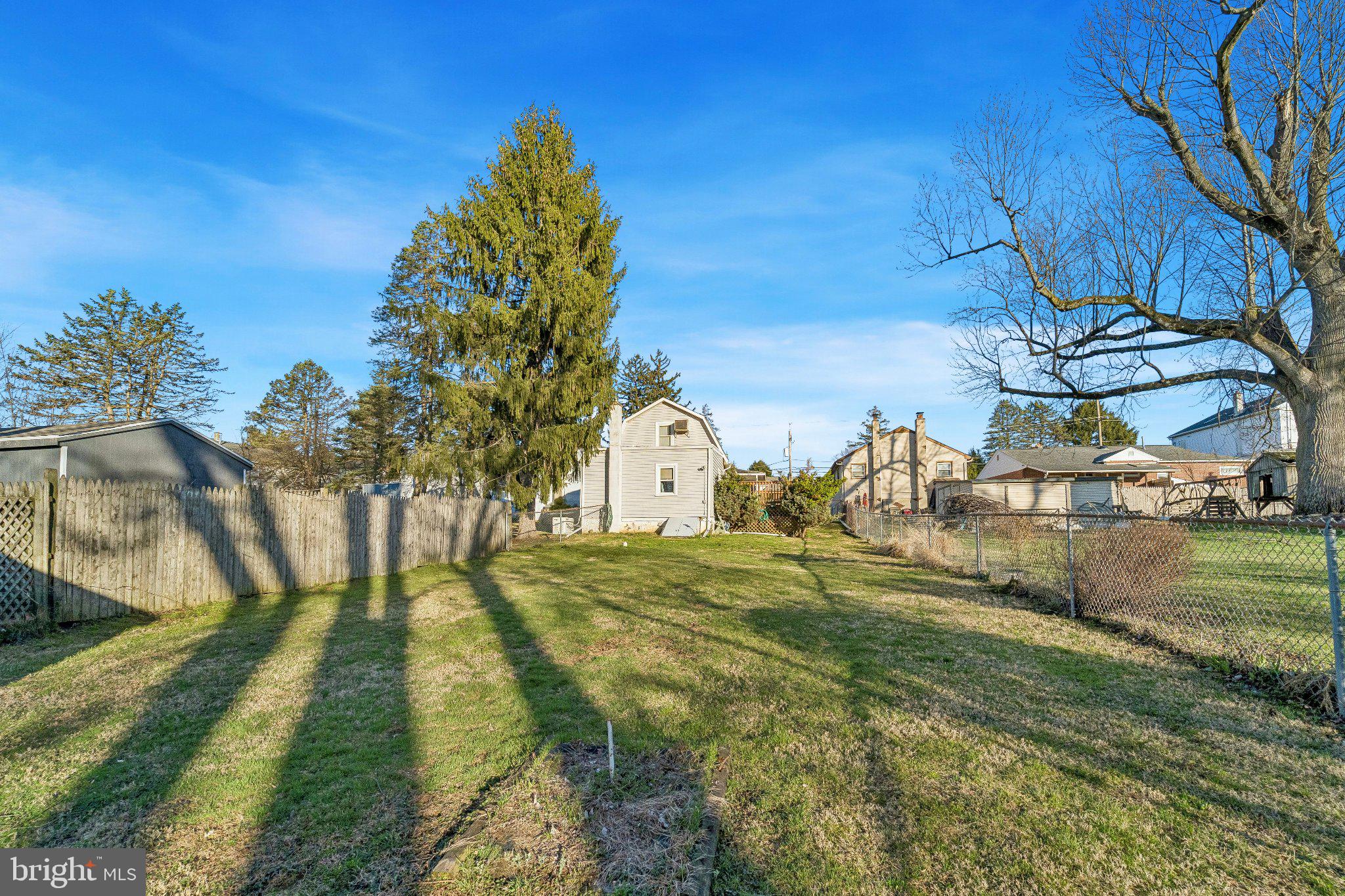 309 Dutton Mill Road Brookhaven, PA 19015 - Photo 19 of 24 Spacious yard with serene surroundings.