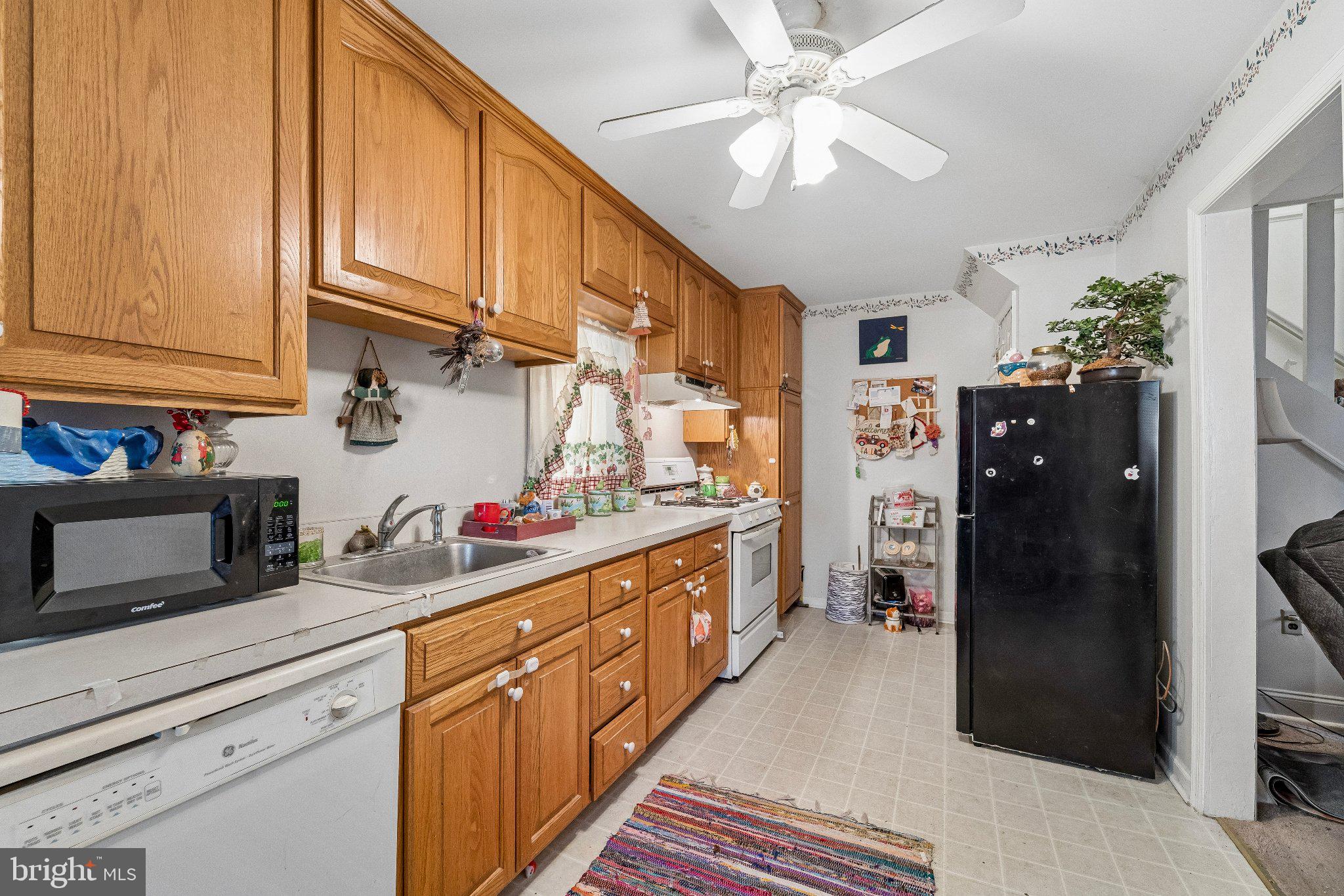 309 Dutton Mill Road Brookhaven, PA 19015 - Photo 4 of 24 Cozy kitchen with warm wood accents.
