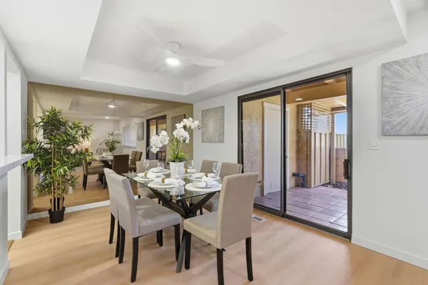 a dining room with furniture and window