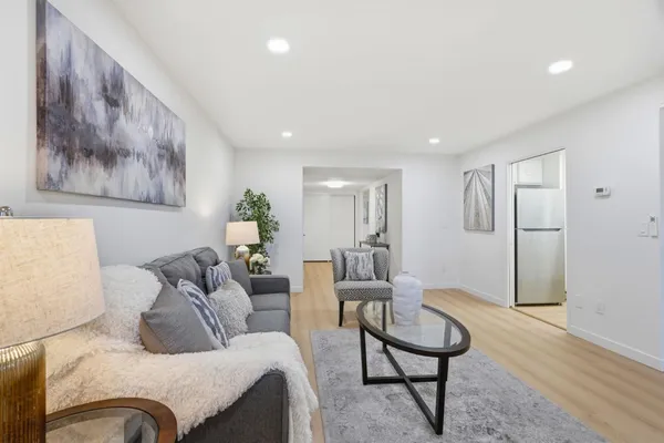 a living room with furniture and a rug