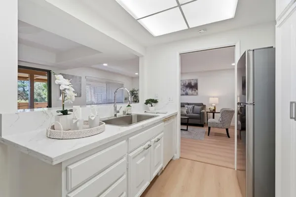 a bathroom with a sink double vanity and a mirror