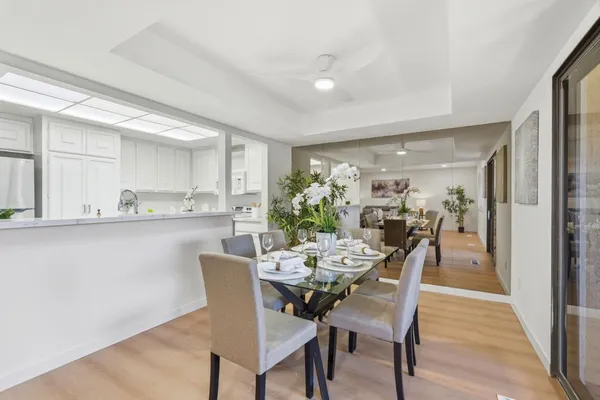 a view of a dining room with furniture and wooden floor