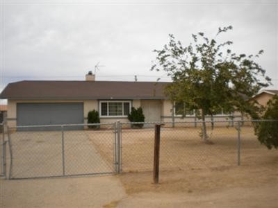 a view of a house with a tree