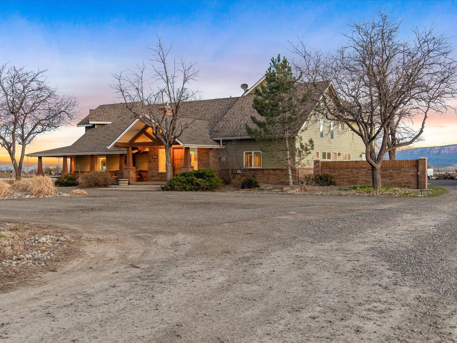 1891 J J 6/10 Road Fruita, CO 81521 - Photo 1 of 41 a front view of a house with a yard
