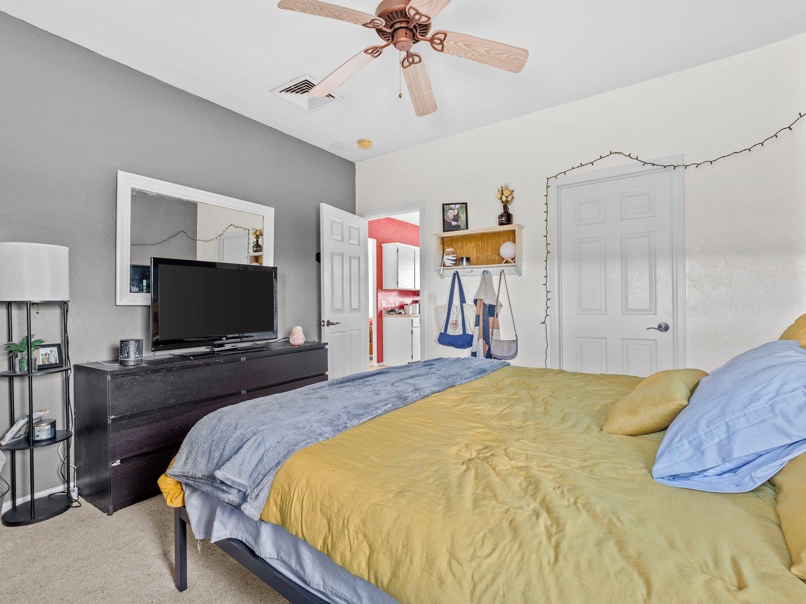 1891 J J 6/10 Road Fruita, CO 81521 - Photo 36 of 41 a bedroom with a bed and a flat screen tv