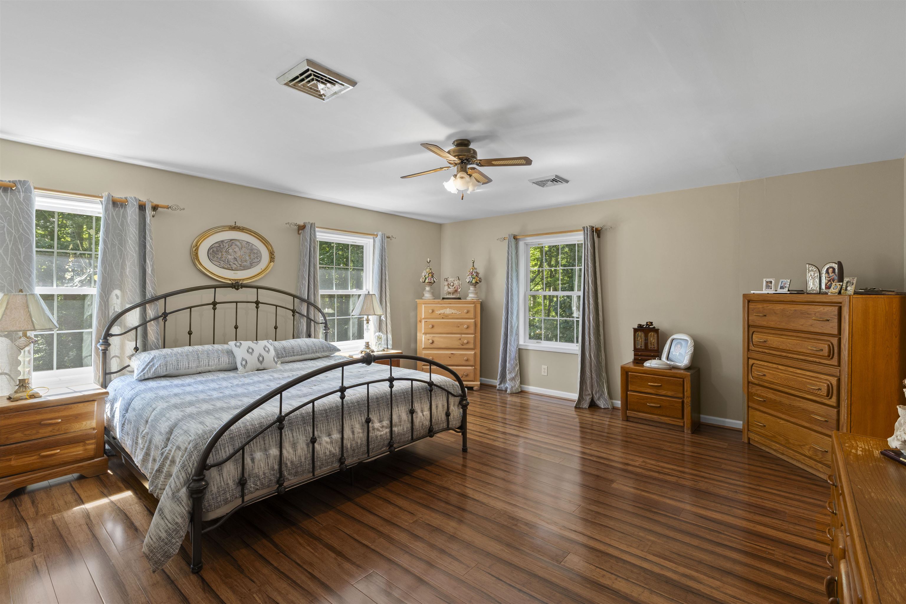 551 Shunpike Road Cape May Court House, NJ 08210 - Photo 15 of 47 a bedroom with a bed and a chandelier