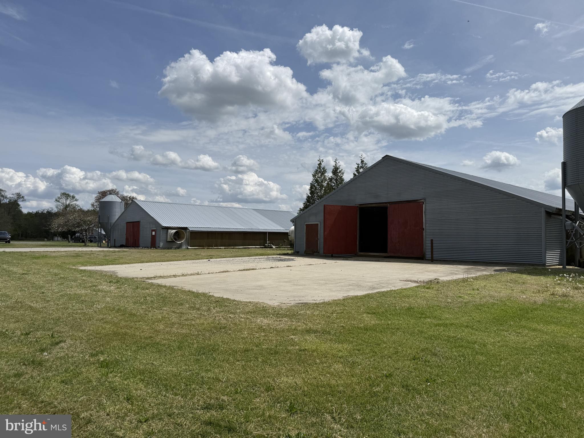 36555 Sheppards Crossing Road Willards, MD 21874 - Photo 15 of 47 a front view of a house with a yard and garage