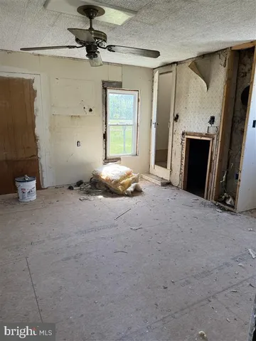 a view of a room with a wooden door