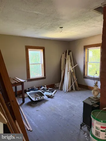 a view of a room with a wooden door
