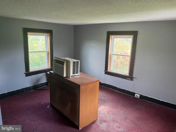 a room with a bed and a window