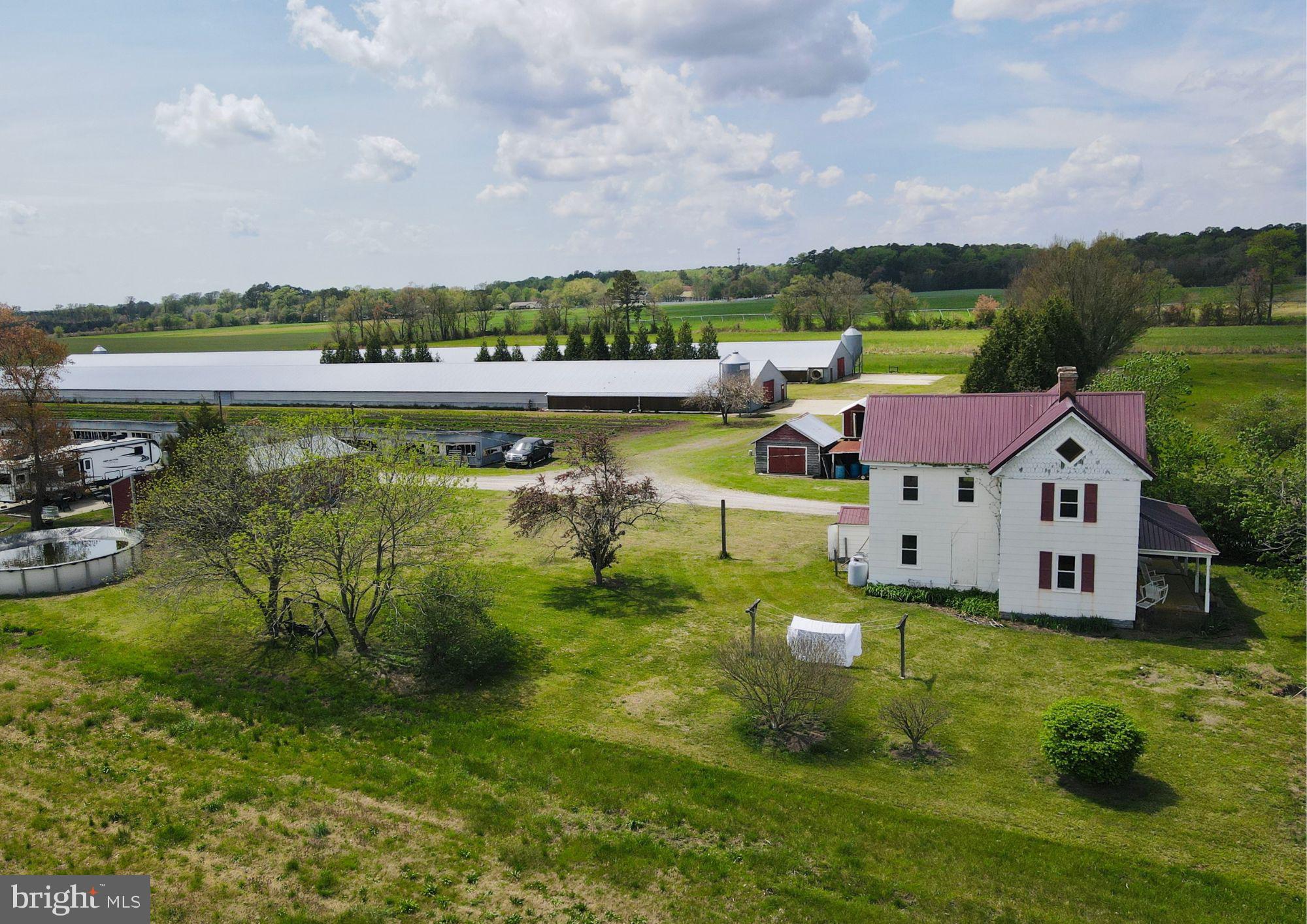 36555 Sheppards Crossing Road Willards, MD 21874 - Photo 6 of 47 an aerial view of a house with a garden and lake view