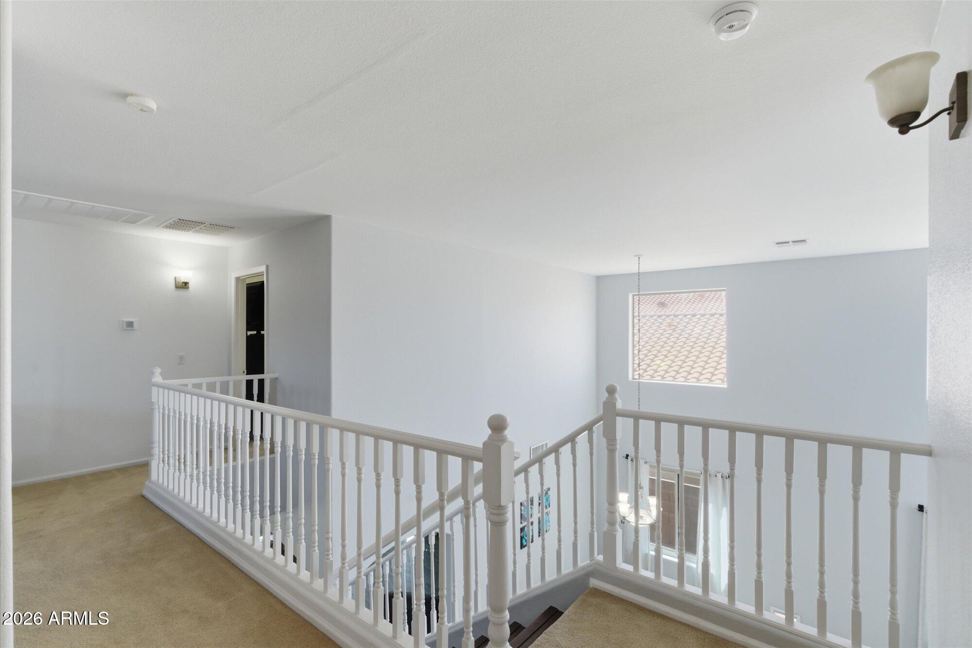 21915 Dietz Drive Maricopa, AZ 85138 - Photo 14 of 31 a view of a hallway with a window