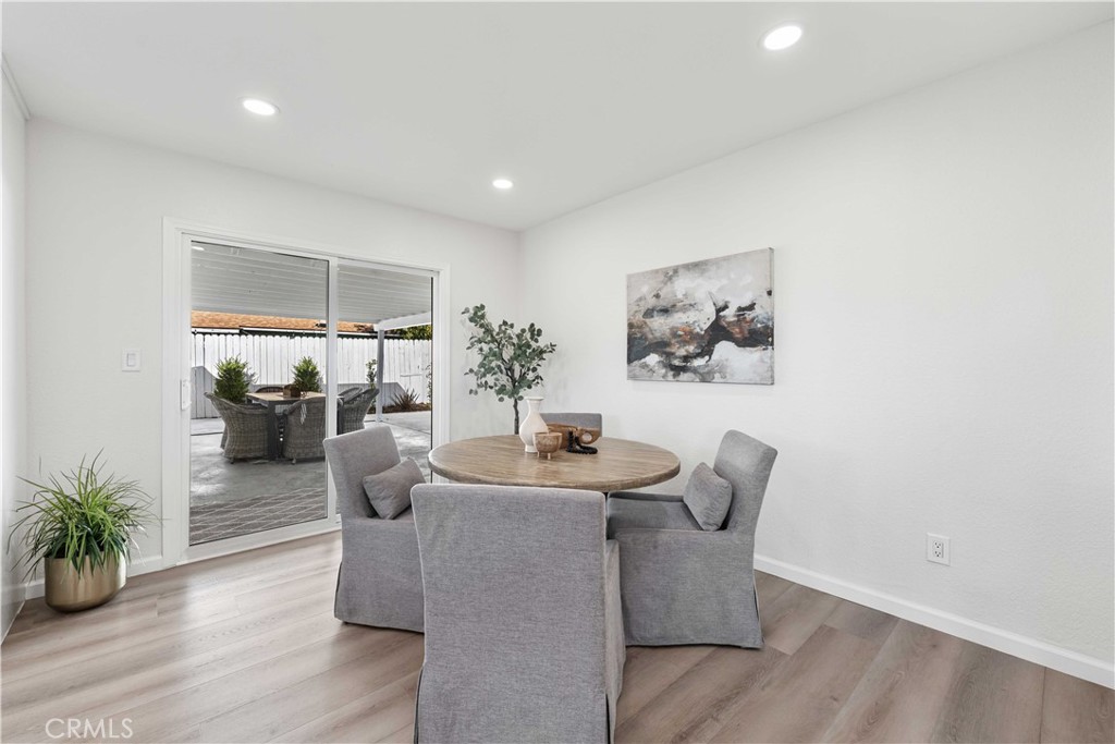 727 North Burney Street Rialto, CA 92376 - Photo 14 of 40 a dining room with furniture and wooden floor