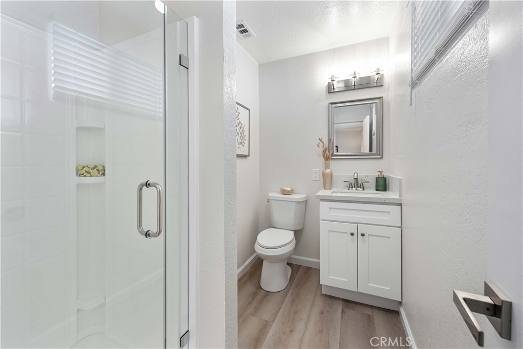 727 North Burney Street Rialto, CA 92376 - Photo 18 of 40 a bathroom with a toilet sink and shower
