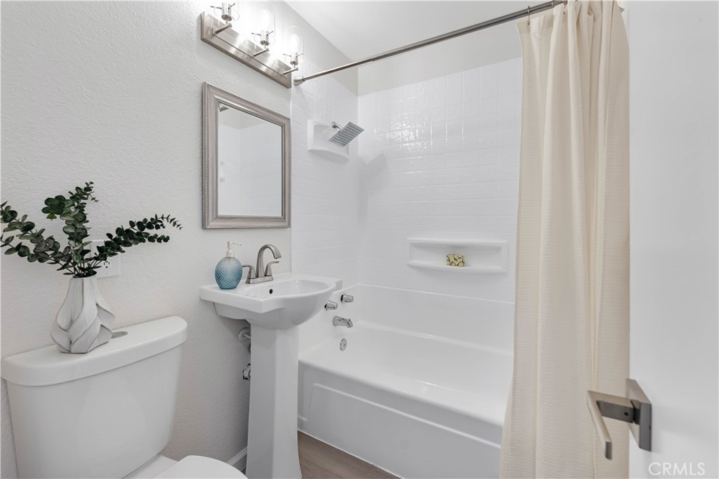 727 North Burney Street Rialto, CA 92376 - Photo 23 of 40 a bathroom with a sink a toilet and shower