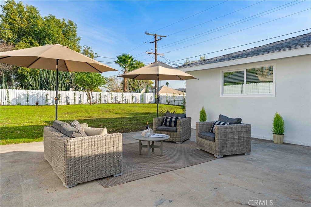 727 North Burney Street Rialto, CA 92376 - Photo 27 of 40 a backyard of a house with table and chairs