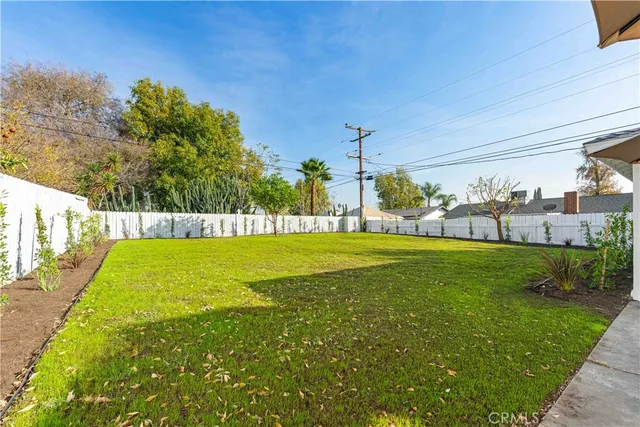 a view of a swimming pool with a yard